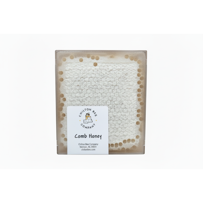 Pure Alabama comb honey in plastic cassette container showing white capped honeycomb cells