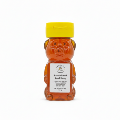 Raw wildflower honey bear bottle 1/2 pound showing golden color
